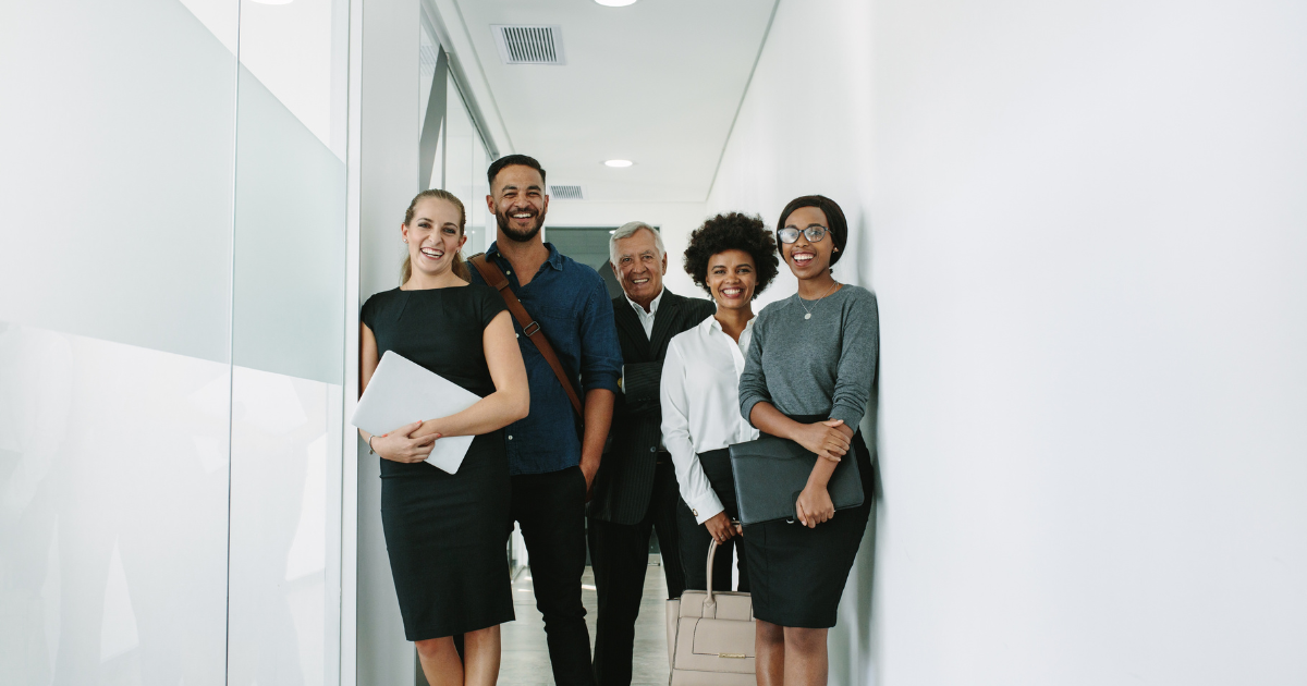 Multiracial Corporate Professionals in office hallway